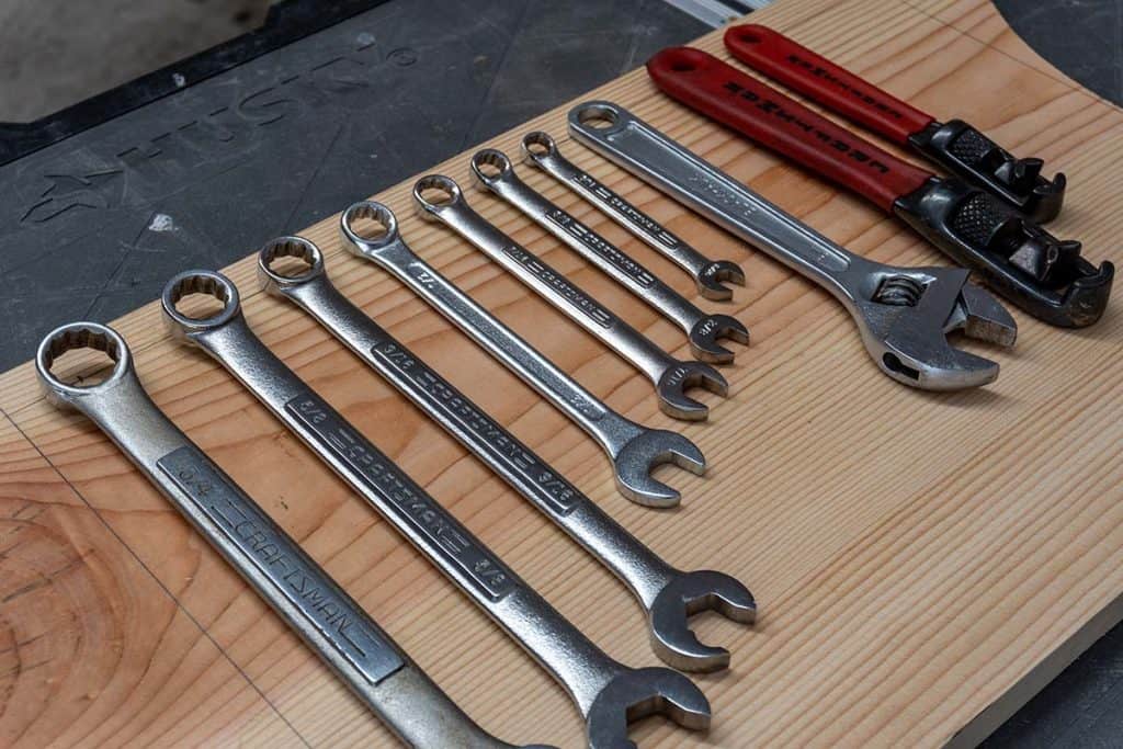 Wrenches laid out on wood